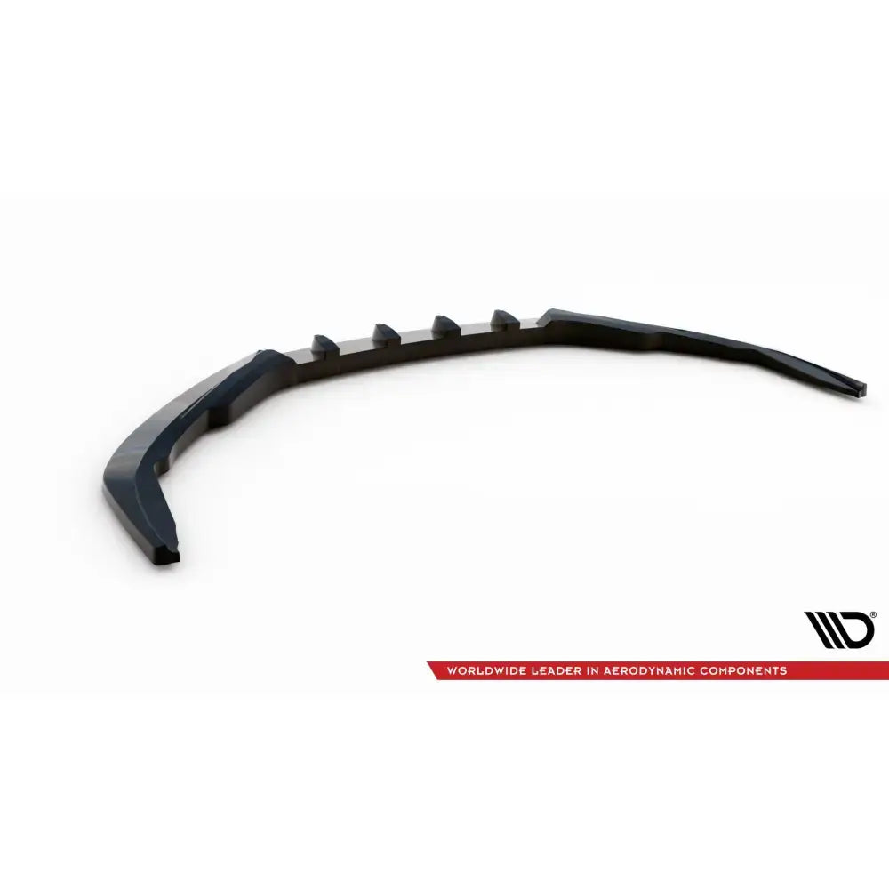 Front lip til Porsche 718 Cayman 982c V.2, svart buet spoiler med opphøyde seksjoner, sett skrått ovenfra.