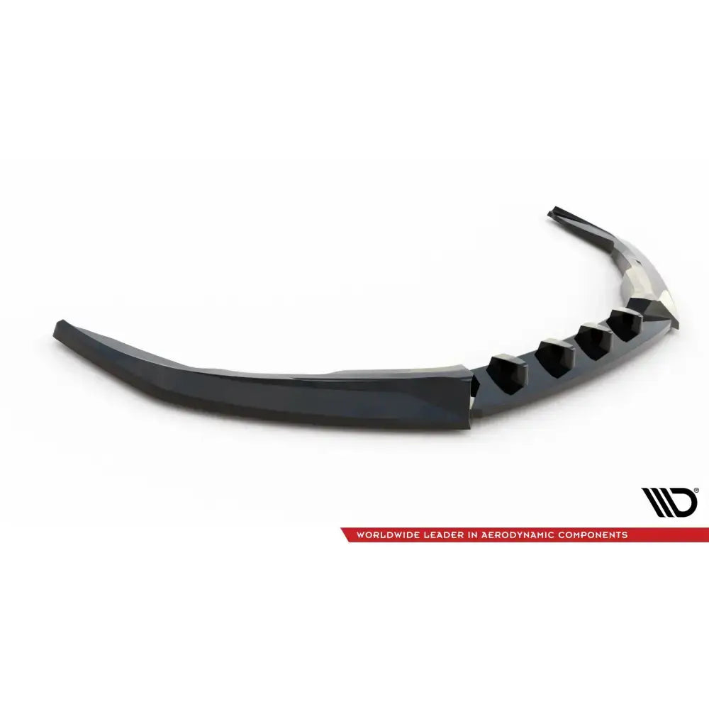 Frontspoiler Porsche 718 Cayman 982c V.2 i sort plast med sekskantede utskjæringer, sett fra skrå vinkel.