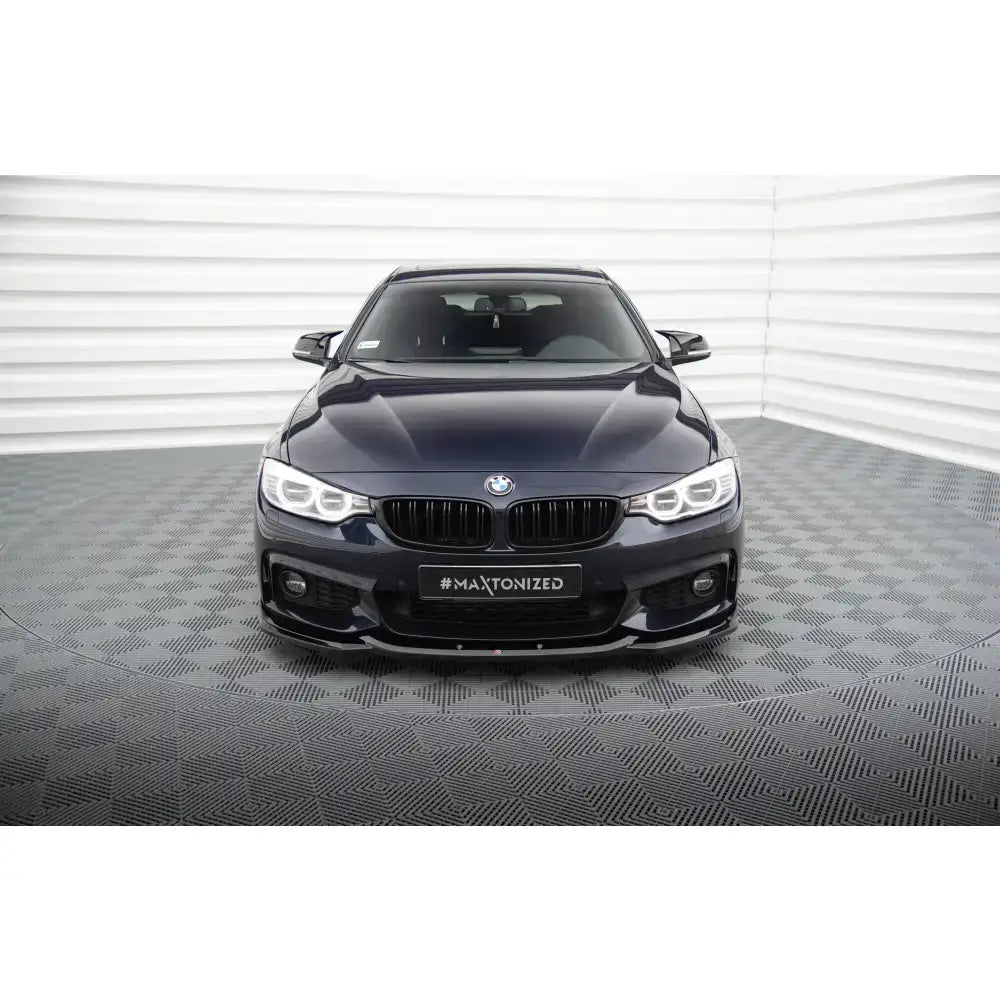 Spoiler til BMW 4 Gran Coupe M-Pack F36 V.2, svart bil forfra med LED-lys og sort frontgrill.