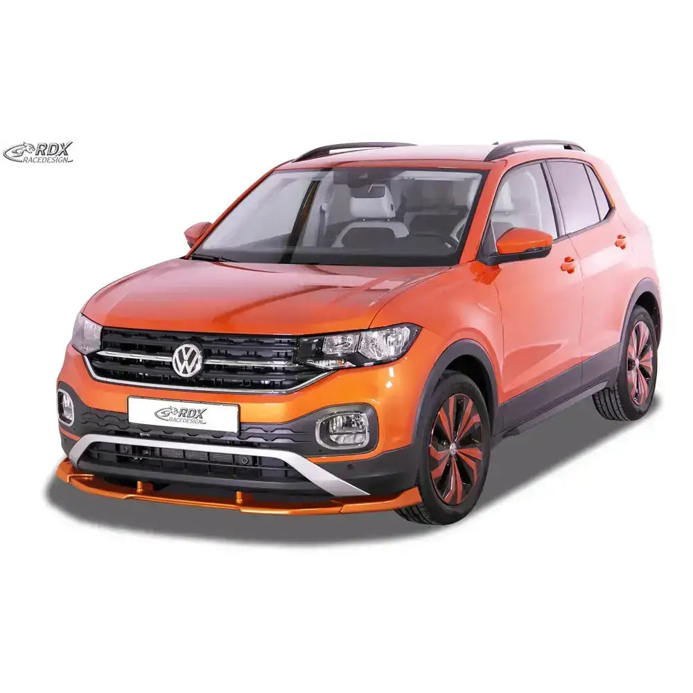 Frontleppe på oransje Volkswagen T-Cross 18- med svarte detaljer og sølvfargede innslag på fronten.