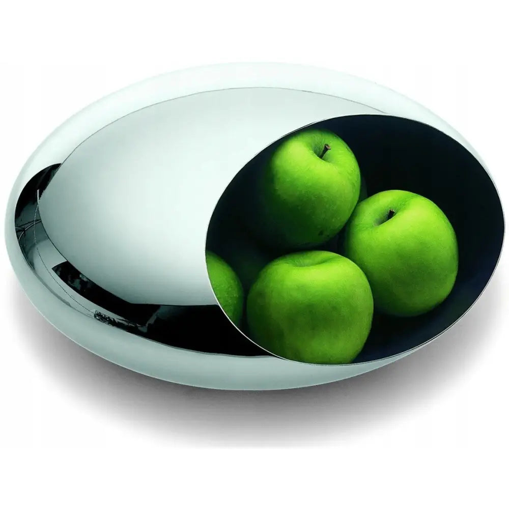 Fruktskål Cocoon i polert stål, oval form fylt med grønne epler, fotografert litt ovenfra.