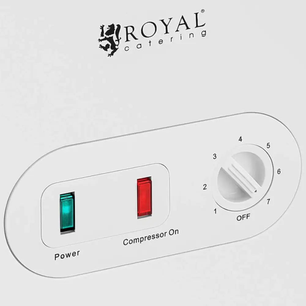 Fryseboks kontrollpanel med grønt og rødt lys, tallskive fra 1 til 7 og ROYAL catering-logo øverst.