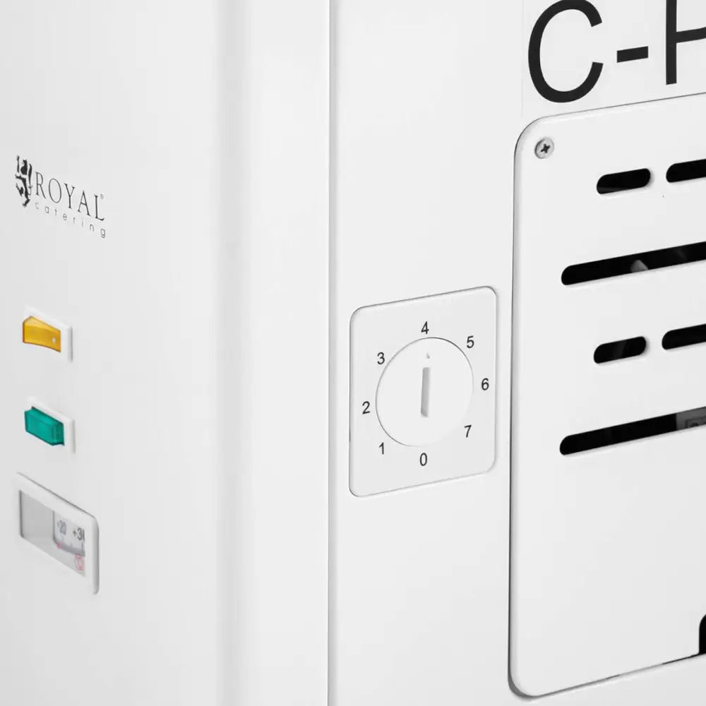 Fryselagerkasse med glasslokk, nærbilde av manuell dreieknapp, ventilasjonsåpninger og fargede indikatorlamper.