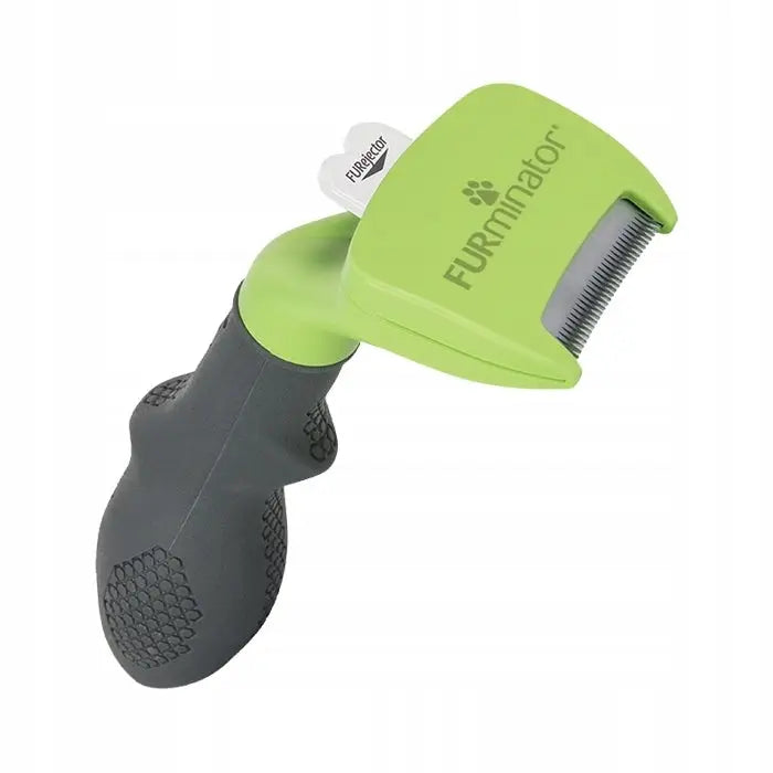Furminator til Hund S Kort Pels, grønn og svart børste med ergonomisk håndtak, skrå visning av kamtenner og knapp.