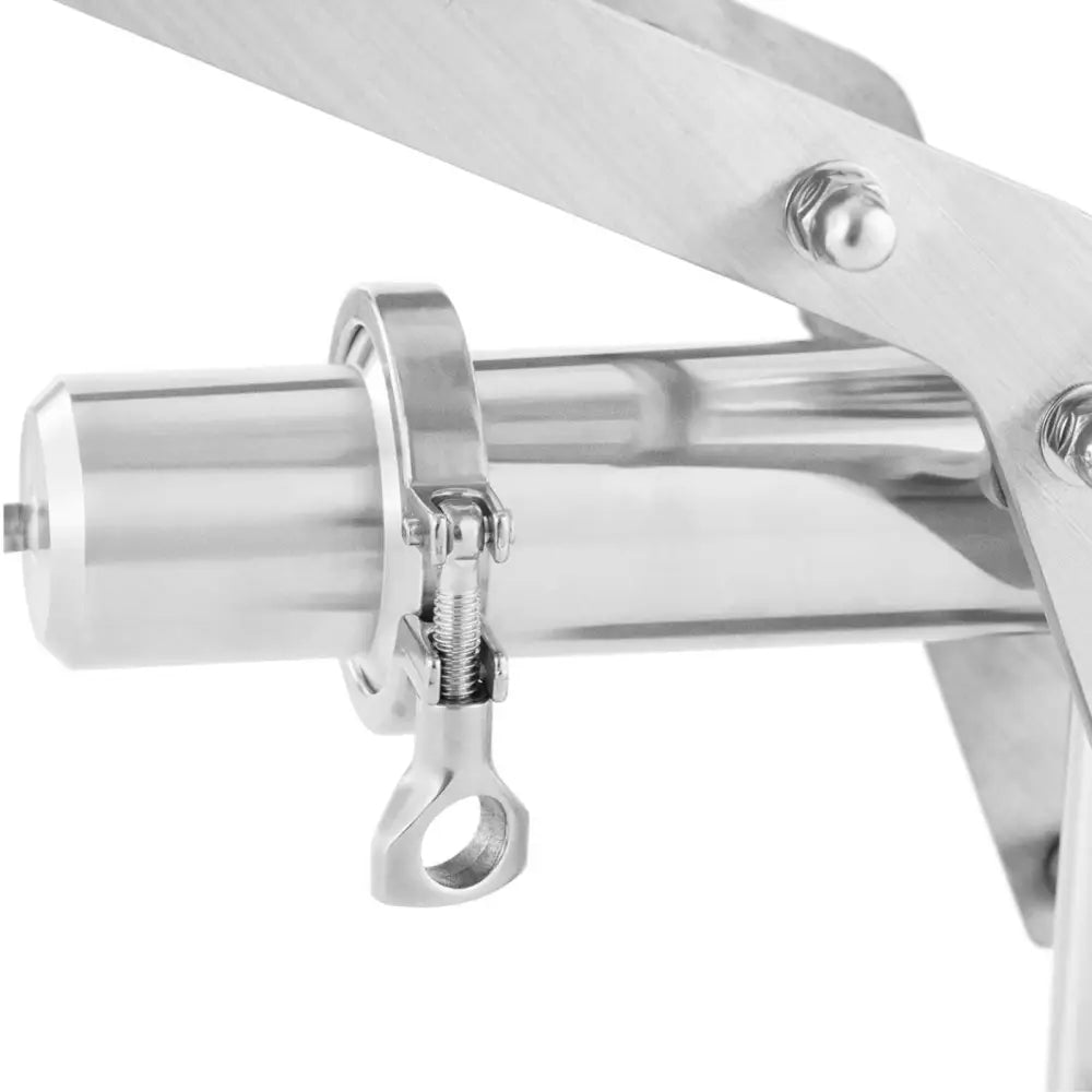 Fylling sprøyte for churros, nærbilde av rustfri sylinder med låsemekanisme og synlige industribolter.