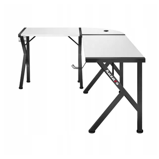 Gaming hjørnebord Huzaro Hero 6.3 hvit, L-form med sorte ben, kabelhull og hodetelefonkrok synlig fra siden.