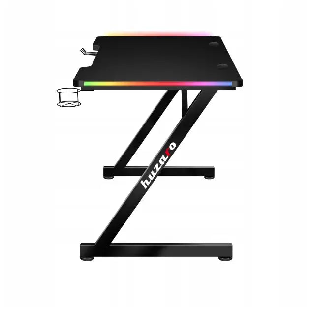 Gamingbord Huzaro Hero 2.5 RGB, sidevisning med Z-formet ramme, RGB-lys og kopp-holder på venstre side.
