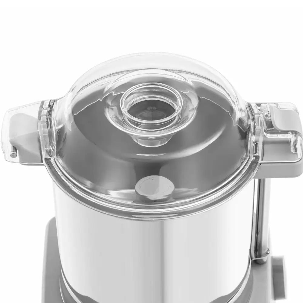 Gastronomisk kuttermaskin sett ovenfra, viser transparent lokk med åpning og robuste plastikkhåndtak.