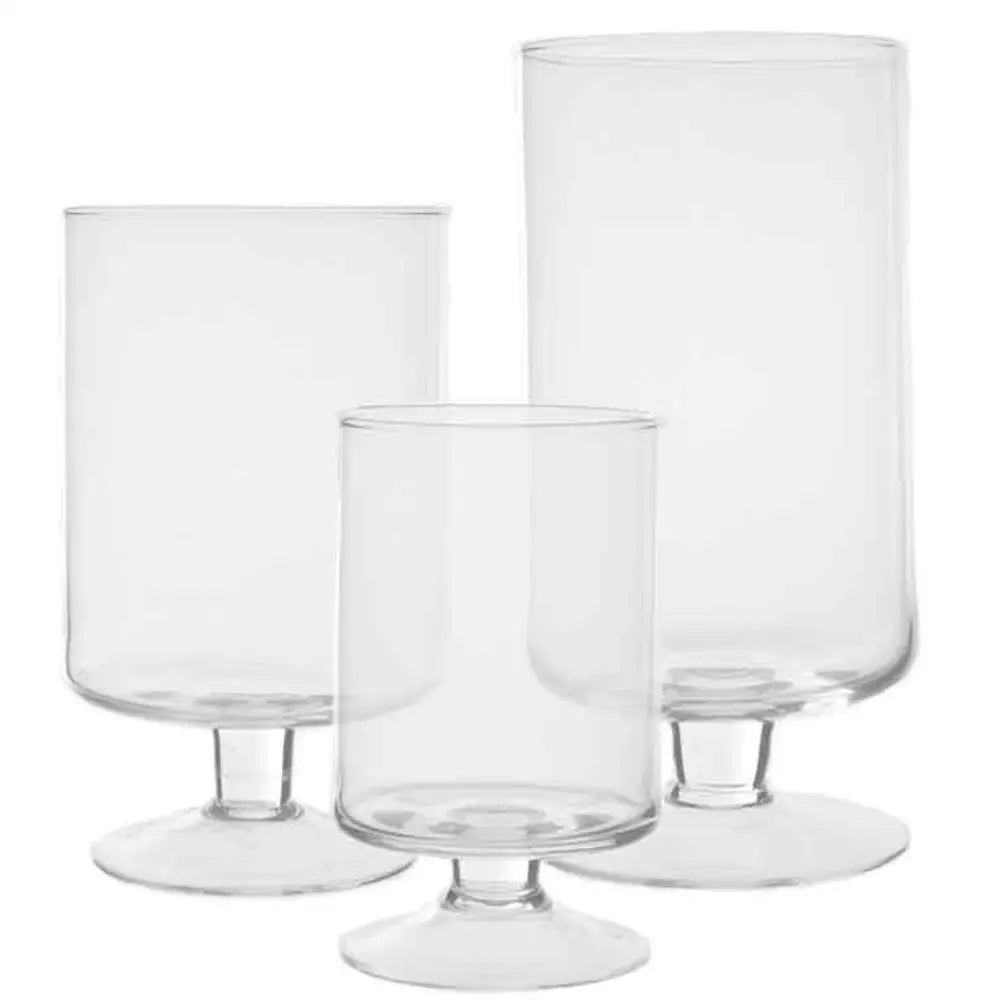 Glamour lysestaker sett med tre glasslanterner, frontvisning i ulike høyder på stett og fot.