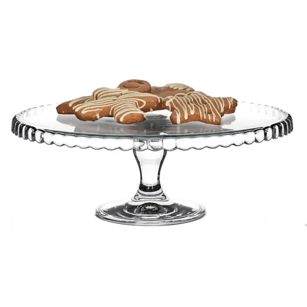 Gravert glassfat med dekorativ kant, sett fra siden, servert med glaserte småkaker på toppen.