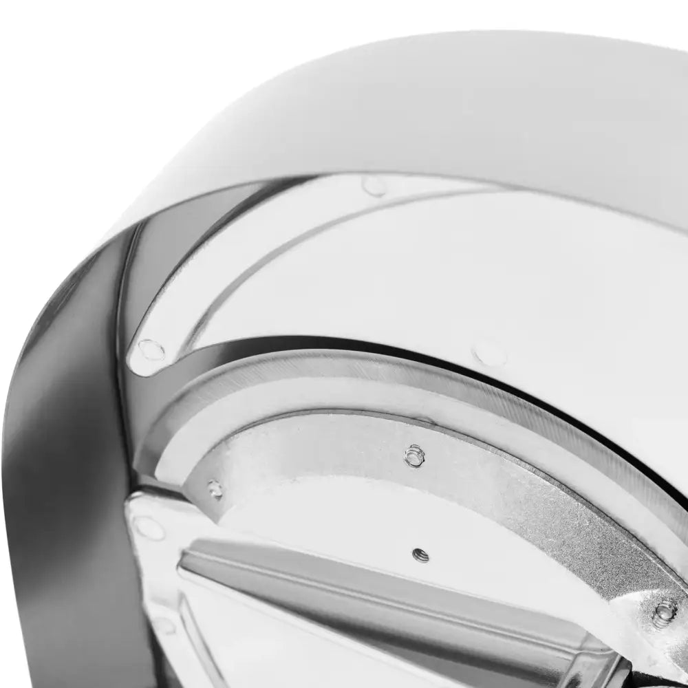 Håndholdt veg- og fruktskiver, nærbilde av metalloverflate med synlige skruer og buede former.