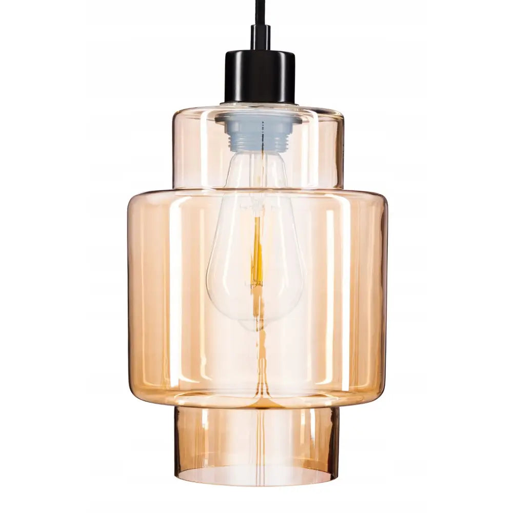 Hengelampe i glass gull, rund pendel med ravfarget glass og synlig lyspære i industriell stil.