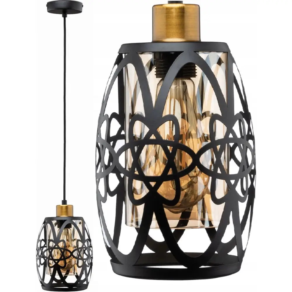Hengelampe i svart metall med utskåret skjerm, ravfarget glass og synlig gyllen lyspære fra siden.