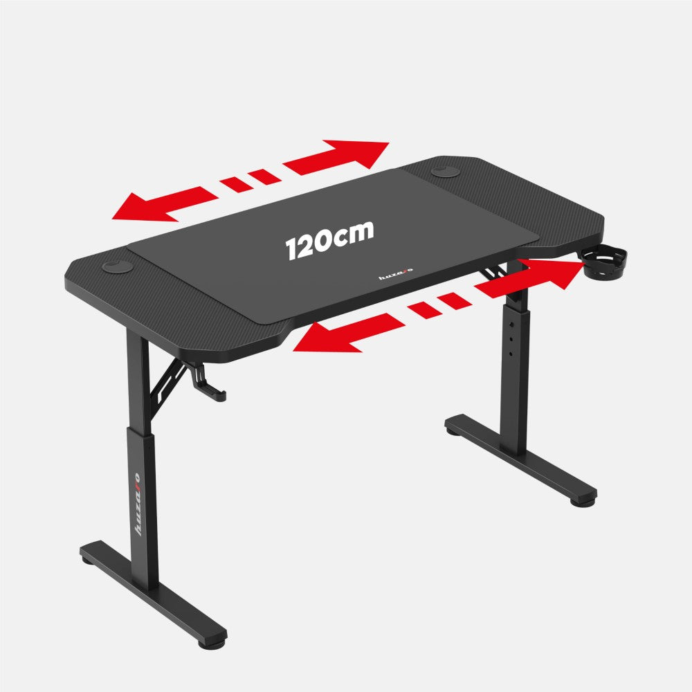 Huzaro Hero 2.6 svart gamingbord med skjerm og tastatur på bordet