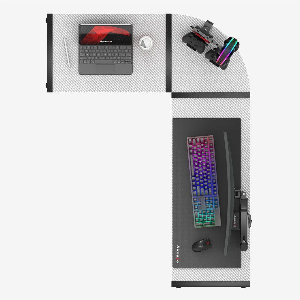 Huzaro Hero 6.0 hvit gamingbord – nærbilde av carbonbelegg på bordflaten