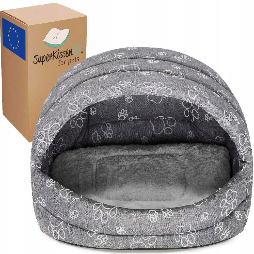 Hundehus Seng for Hund og Katt XL Claw, grå huleform med poteavtrykk og mykt plysjfôr, sett forfra med emballasje bak.