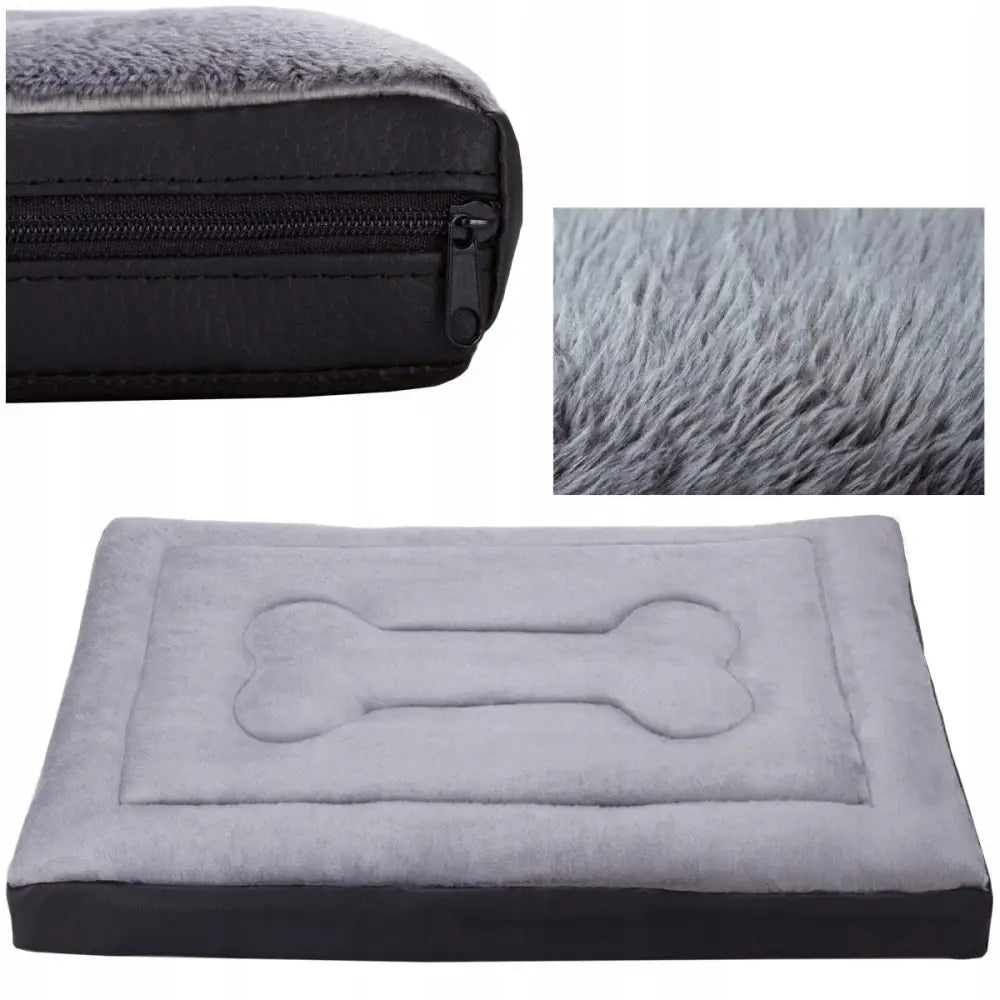 Hundeseng Welsti Madrass Pels 130x90, nærbilde av grå, pelsaktig overflate med brodert beinmotiv og synlig glidelås i siden.