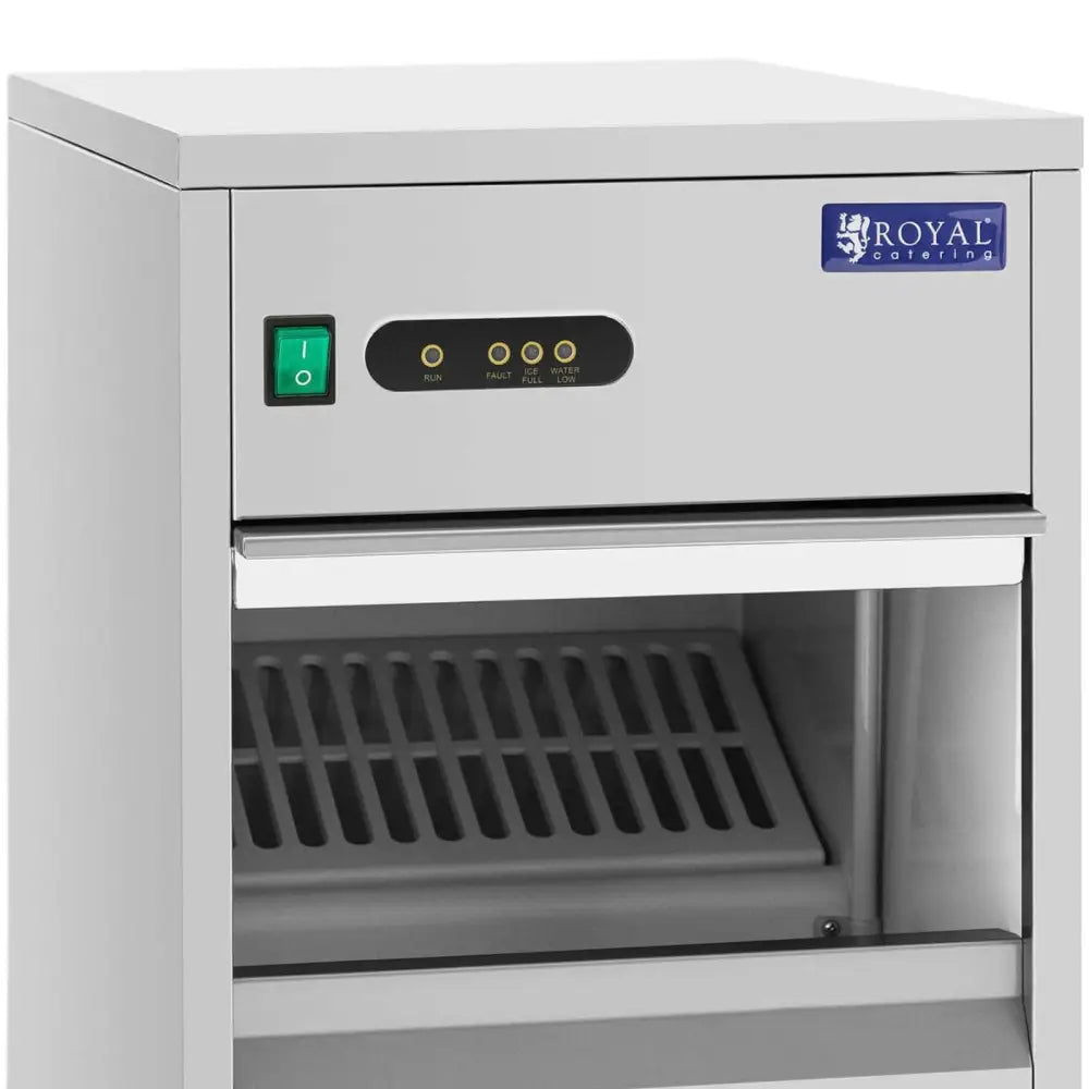 Ismaskin for barer, nærbilde av front med åpen luke, synlig gitterbrett og betjeningspanel med indikatorlamper.