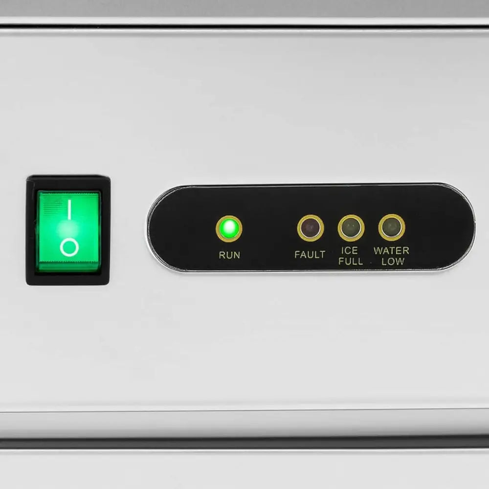 Ismaskin for barer, nærbilde av betjeningspanel i børstet stål med grønn bryter og statuslamper.