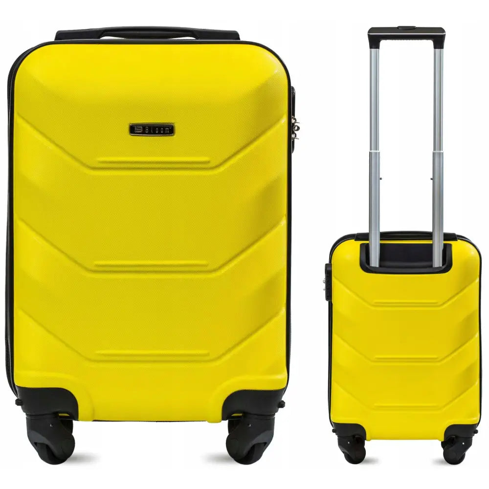 Gul kabinveske Bloom S, hardplast med fire svarte hjul og teleskophåndtak, sett fra begge sider.