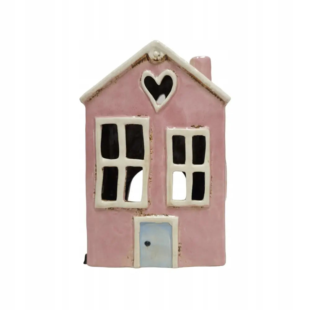 Keramisk tealight lyshus i rosa, frontvisning med hvite vinduskarmer, blå dør og hjerteformet vindu øverst.