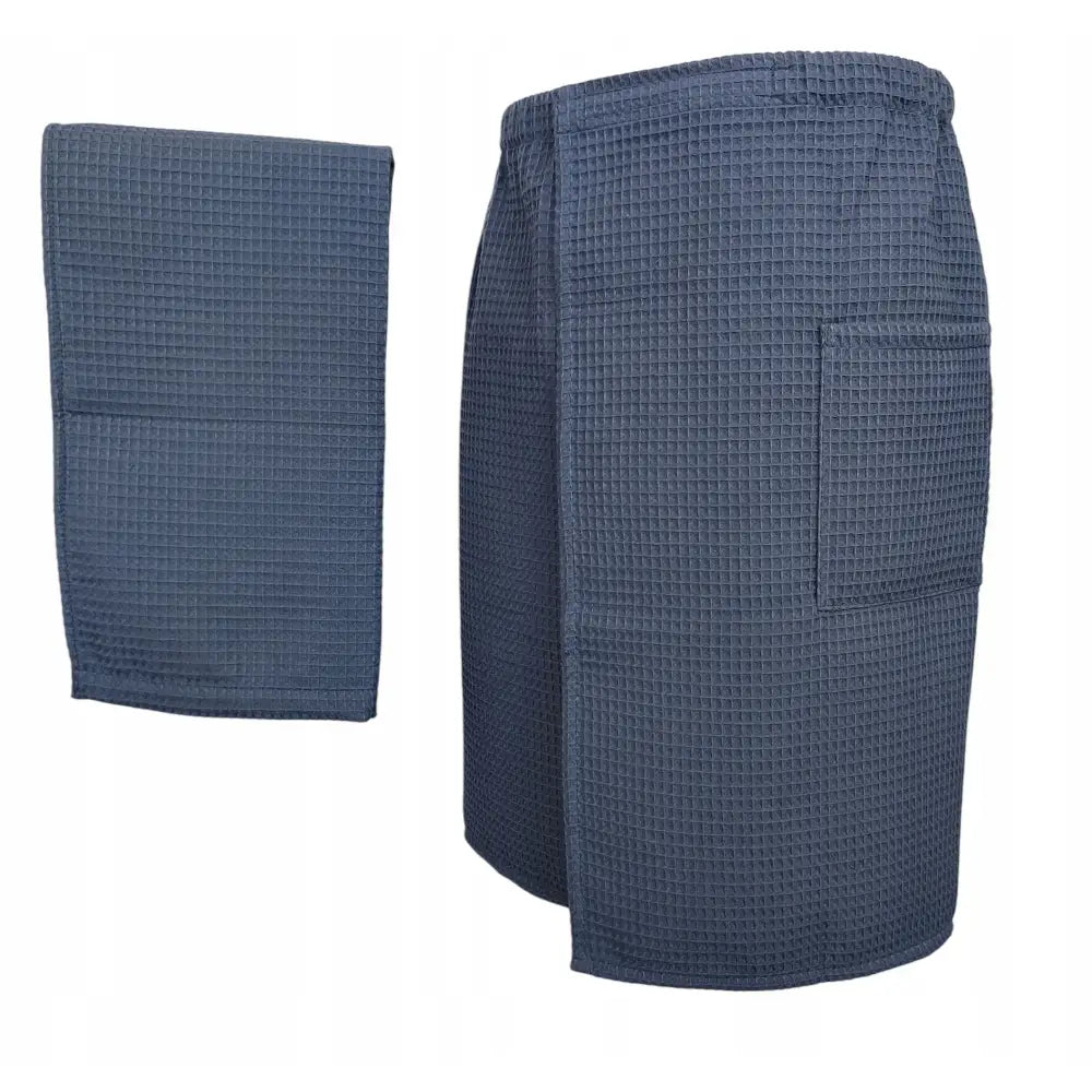 Kiltsett til badstue i antrasitt, sidevisning av vaffelmønstret kilt med lomme og brettet matchende håndkle.