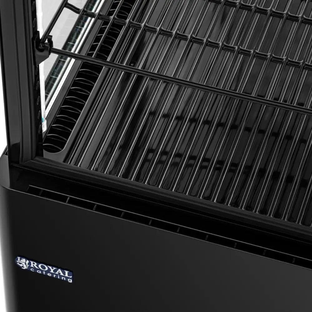 Kjølethylle i svart med tre gjennomsiktige glasshyller, sett fra siden, rommer 58 liter.