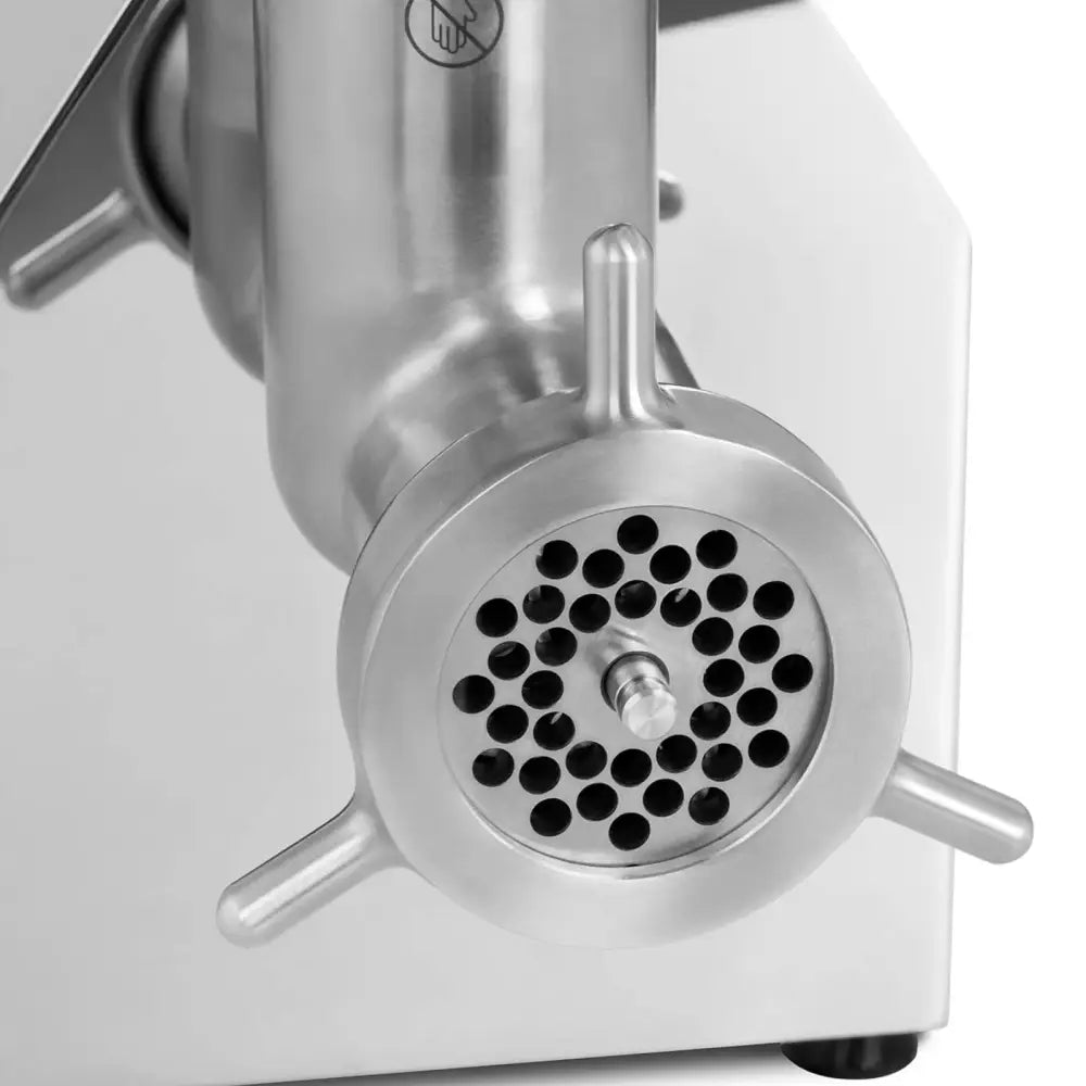 Kjøttkvern i rustfritt stål, nærbilde av fronten med hullskive og tre karakteristiske utstikkere.