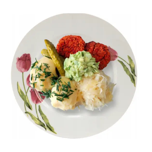 Komplett middagsservise, tallerken med tulipandekor fylt med planteboller, poteter, surkål og tilbehør.