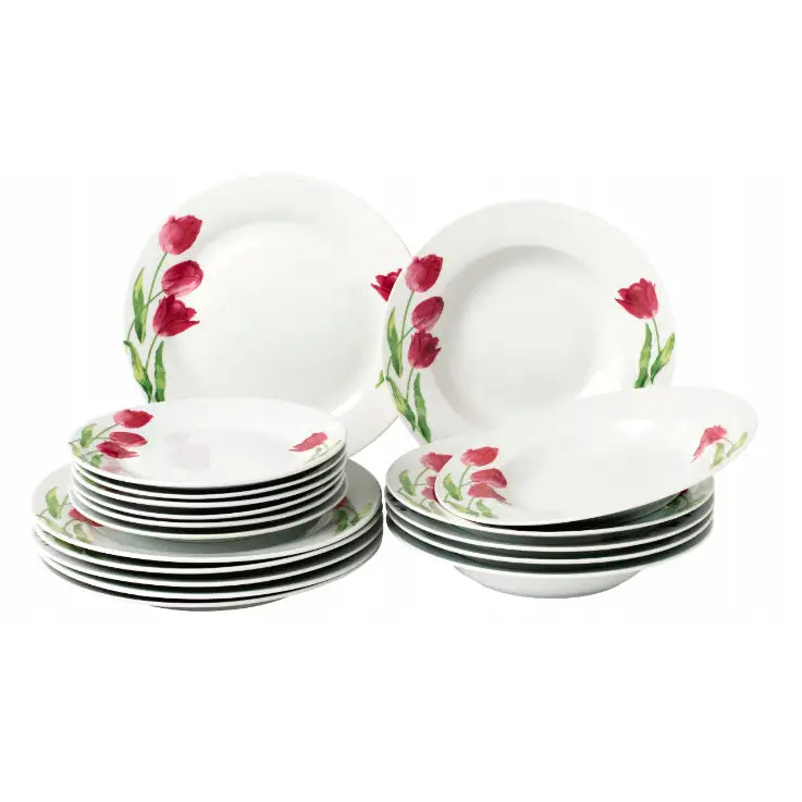 Komplett middagsservise i hvitt porselen med røde blomster langs kanten, flate og dype tallerkener sett skrått.