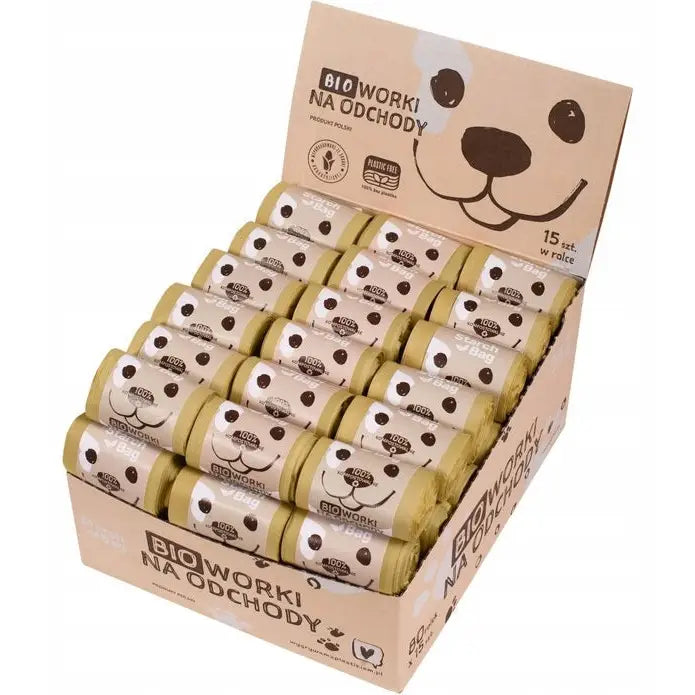 Komposterbare poser for hundemøkk, 63 ruller i eske med hundeansikt-design, presentert i praktisk display.