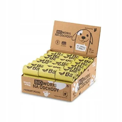 Komposterbare stivelsesposer for avfall, 63 gule ruller stablet i eske med hundemotiv og tydelig etikett.