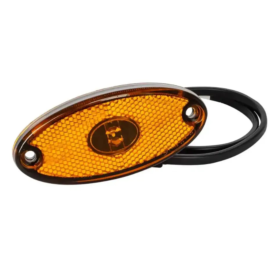 LED sidemarkeringslampe Flatpoint II, oval oransje refleks med bikubemønster og svarte festedetaljer, frontvisning.