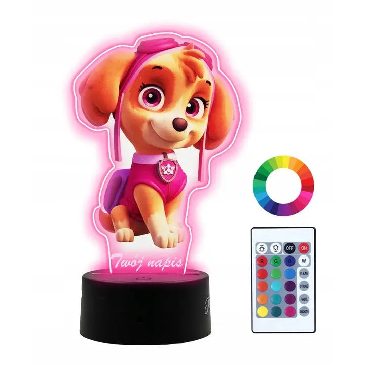 LED-skrivebordslampe med Skye fra Paw Patrol, rosa LED-lys, fjernkontroll og fargehjul ved siden av.