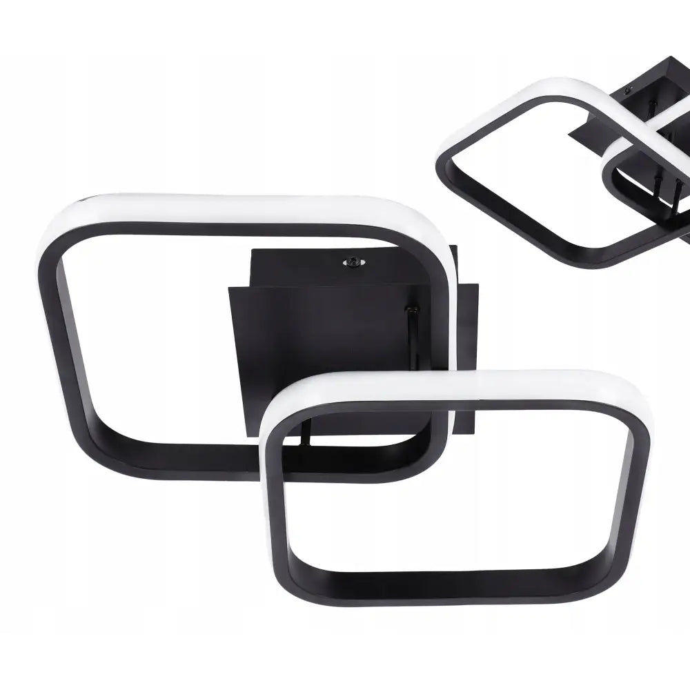 LED-taklampe med to rektangulære rammer i svart og hvitt, minimalistisk design sett fra skrå vinkel.