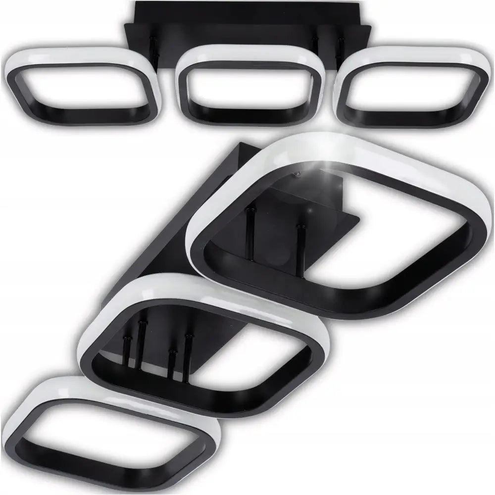 LED-taklampe med fem sorte og hvite firkantede lyselementer i moderne, matt design sett nedenfra.