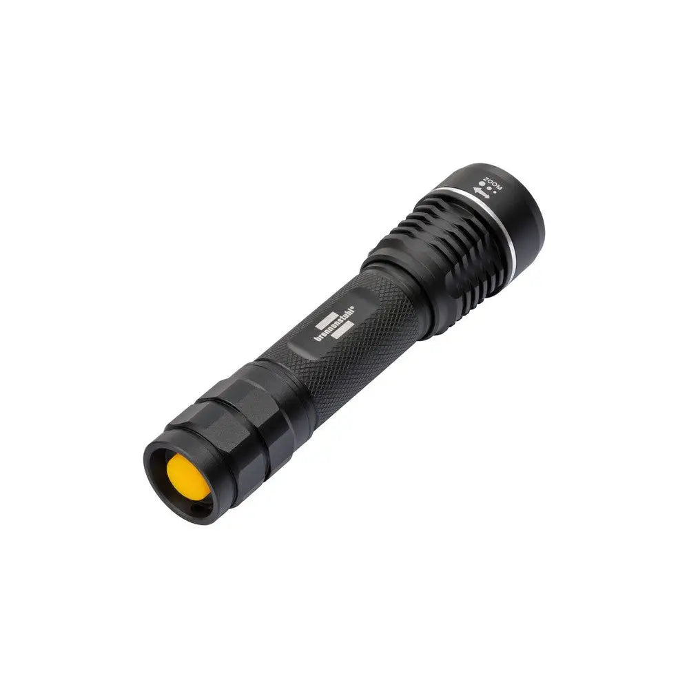 LED lommelykt LuxPremium TL 600, sort metall med gult bryterfelt, rillet grep og synlig logo.