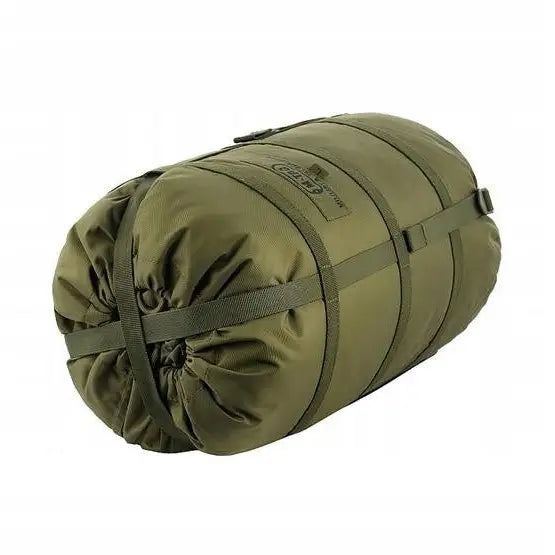 M Tac komprimeringspose XL i olivengrønn nylon, sylinderformet med stramme kompresjonsstropper og snøring.