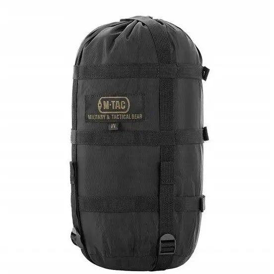 Sort komprimeringspose XL i nylon med justerbare stropper og brodert M-TAC-logo synlig foran.