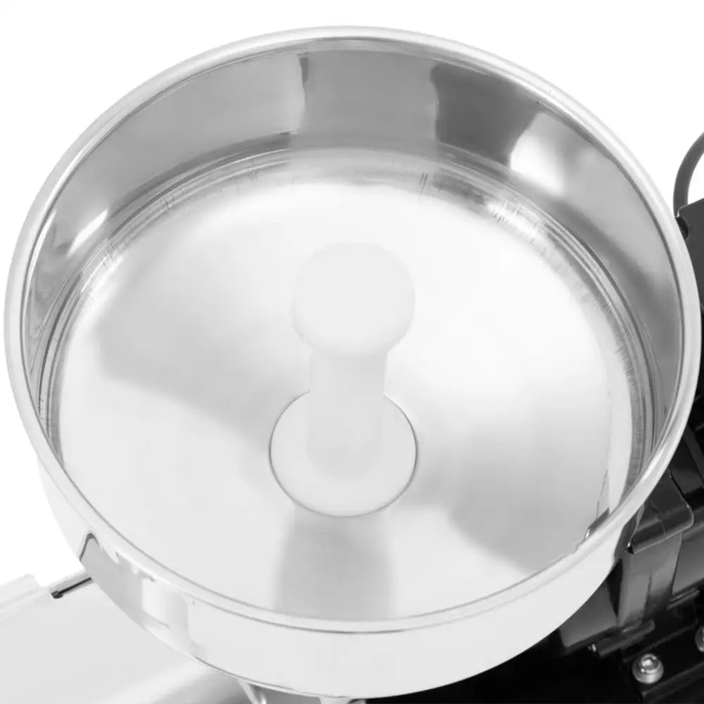 Matetomatkvern i rustfritt stål, toppvisning med hvit sylinder i midten og blank overflate.