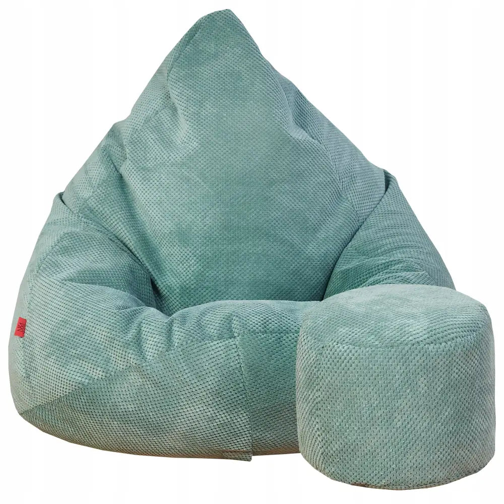 Mega Sakkosekk XXL i lysegrønt småmønstret stoff med matchende rund puff og synlig rød etikett på siden.