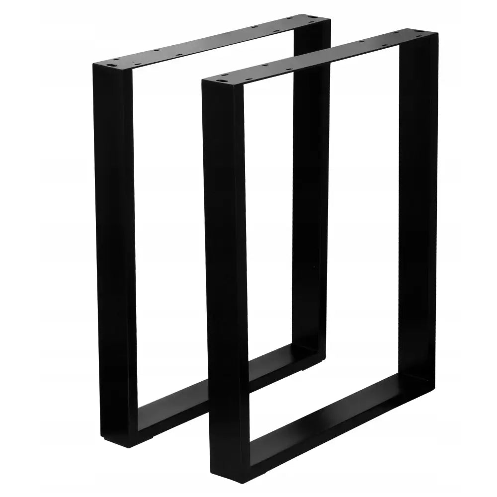 Metallben til bord, sorte og rektangulære, sett fra skrå vinkel med tydelige monteringshull på toppen.