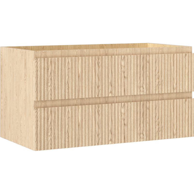 Servantskap 90 cm i lys eik med riflet front og to skuffer, sett fra skrå vinkel foran.