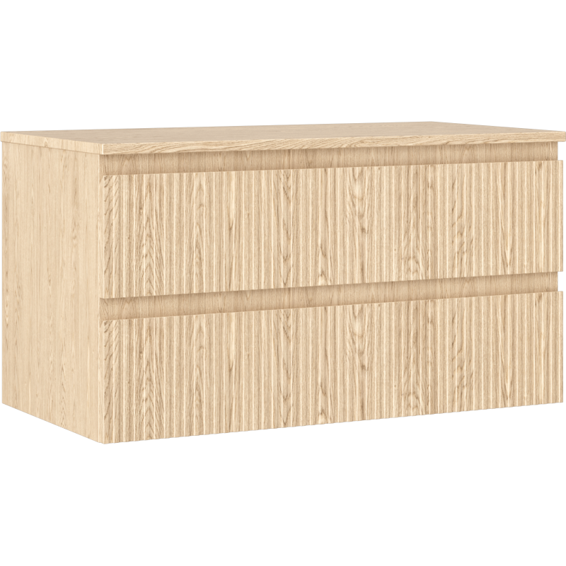 Servantskap i lys eik med to skuffer, riflet front og skjulte grep, vist fra skrå vinkel.