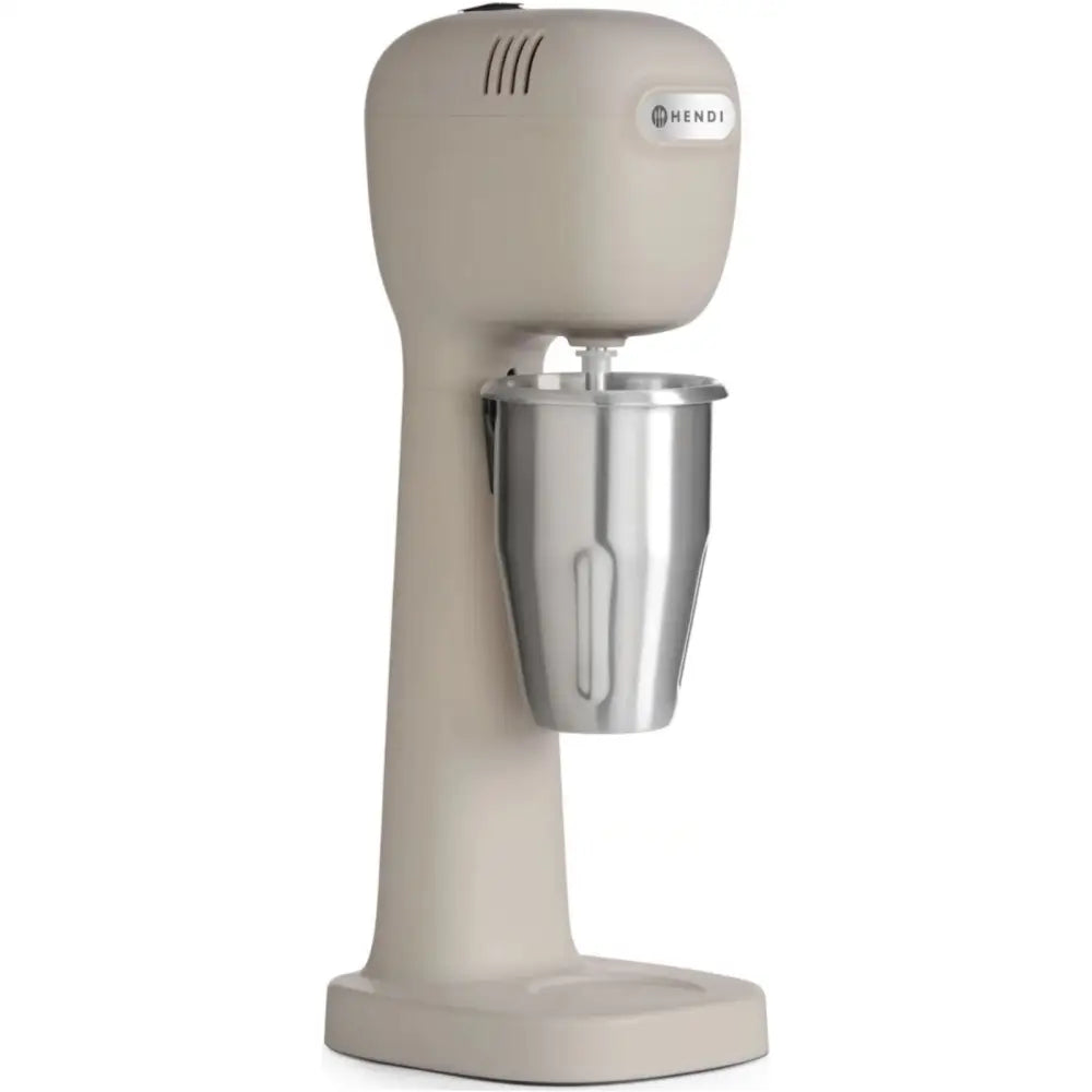 Mikser for melkecocktails i lysegrått, sett fra siden med rustfri stålbeholder og avrundet design.