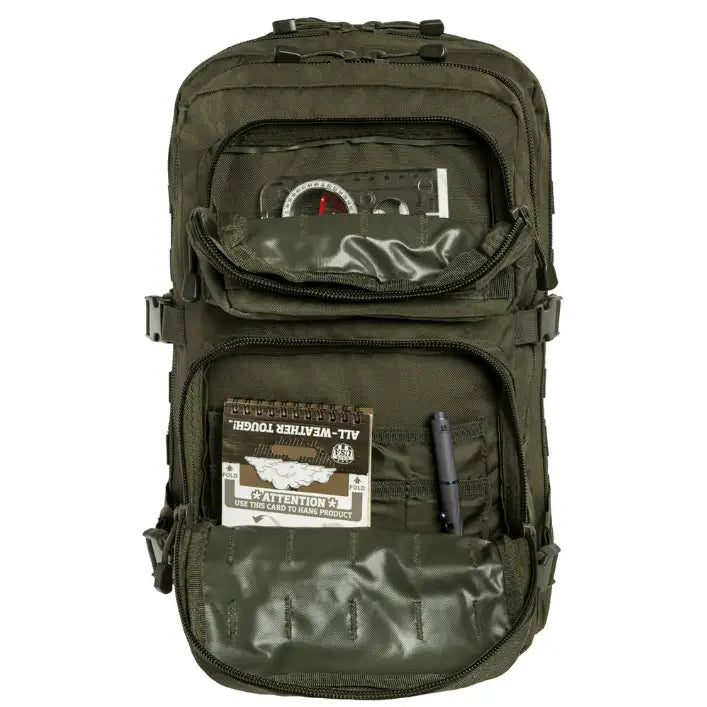 Militær ryggsekk Mil-Tec 36L, frontvisning med synlige lommer, kompass, notatblokk og penn. Robust materiale.