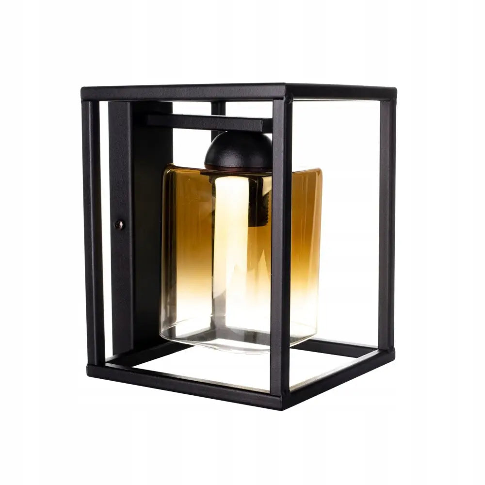 Moderne glass vegglampe med sort ramme og gradient glasskjerm, sett skrått forfra med synlig LED-lys.