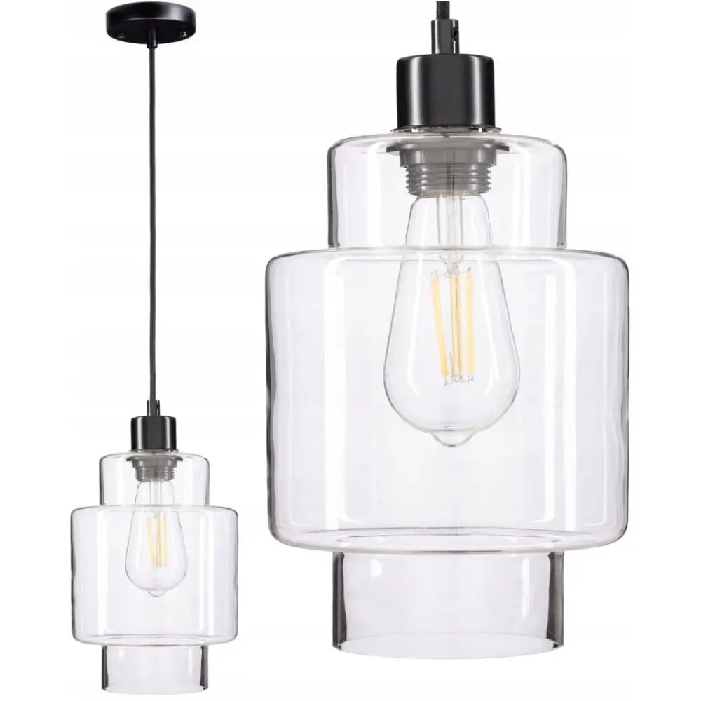 Moderne hengende lampe med sylinderformet glasskjerm og sort oppheng, nærbilde av lyspæren synlig.