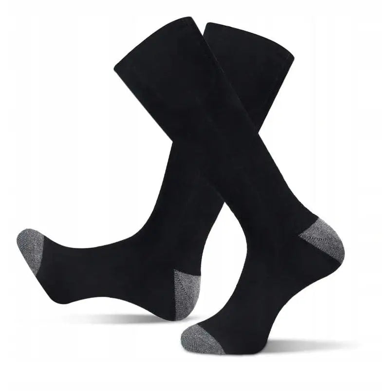 Oppvarmede elektriske sokker i svart med grå forsterkede tær og hæl, sett fra siden mot hvit bakgrunn.