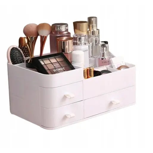 Organisator for kosmetikk, hvit plastboks med fire skuffer og åpne rom fylt med sminke og børster.